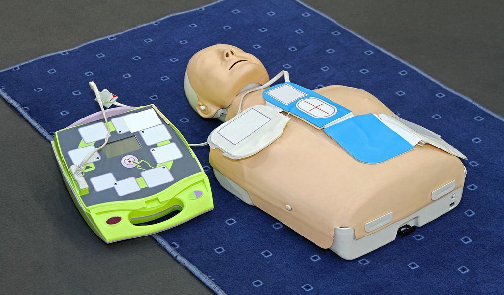 AED dummy Automated External Defibrillator with training dummy mannequin